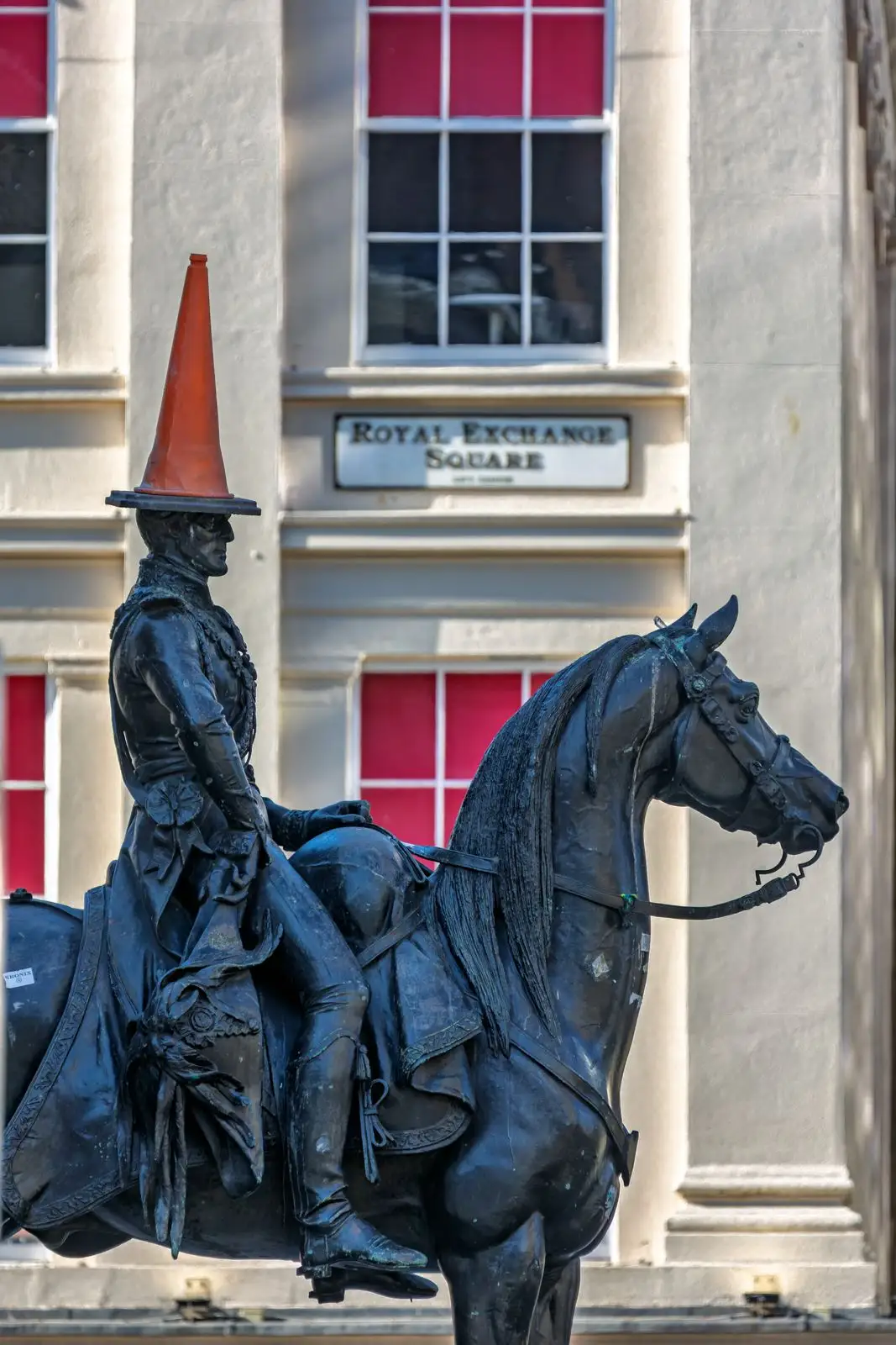 The Duke of Wellington statue in Royal Exchange Square, Glasgow, wearing a traffic cone on its head